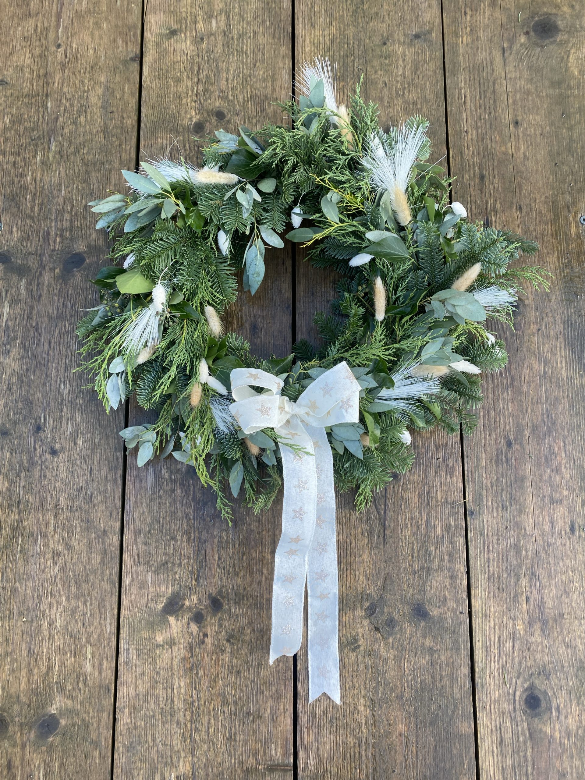 Wreath with cream bow and bunny tails